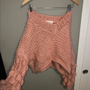 Pink sweater with pom pom sleeve